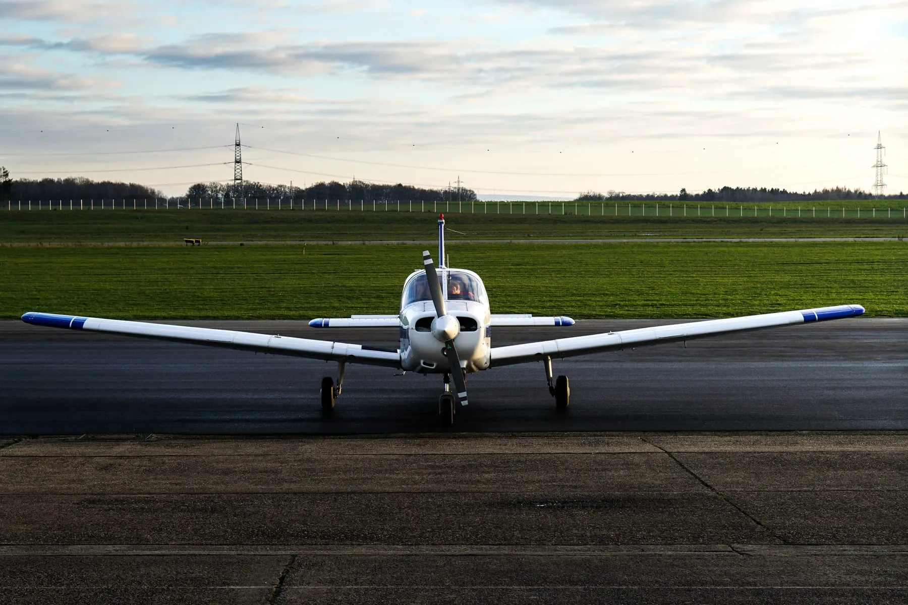 A small propeller aircraft on the apron of a country airfield — Frankfurt-Hahn Airport Transfer (HHN)
