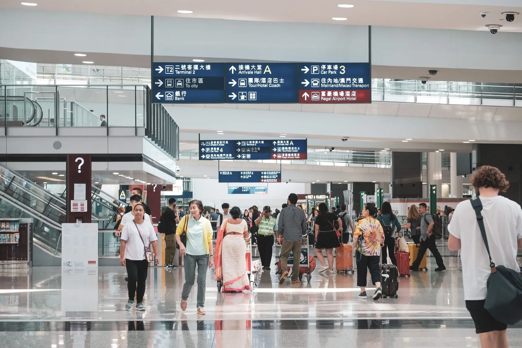Travellers crossing an airport arrivals hall — Frankfurt Airport Arrival Concierge & Chauffeur