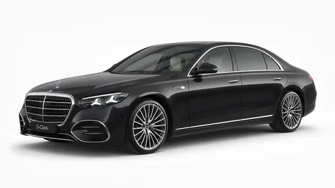 Black 2026 Mercedes-Benz S-Class in a front three-quarter studio view — First Class, chauffeur-driven fleet