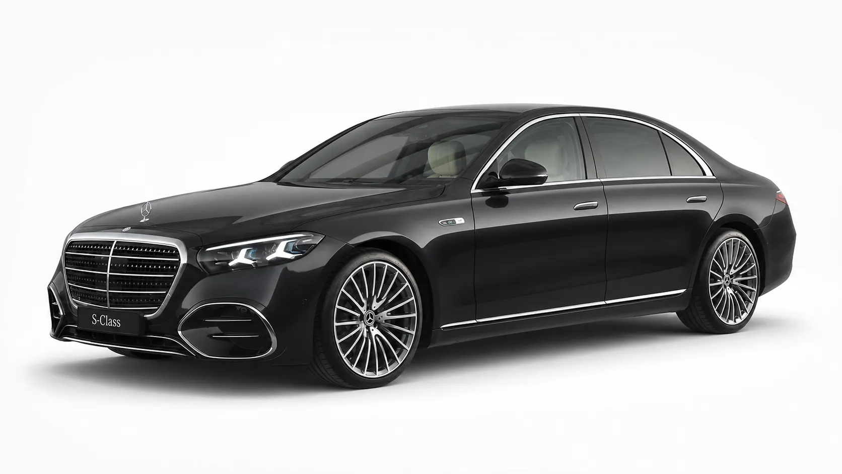 Black 2026 Mercedes-Benz S-Class in a front three-quarter studio view — First Class, chauffeur-driven fleet